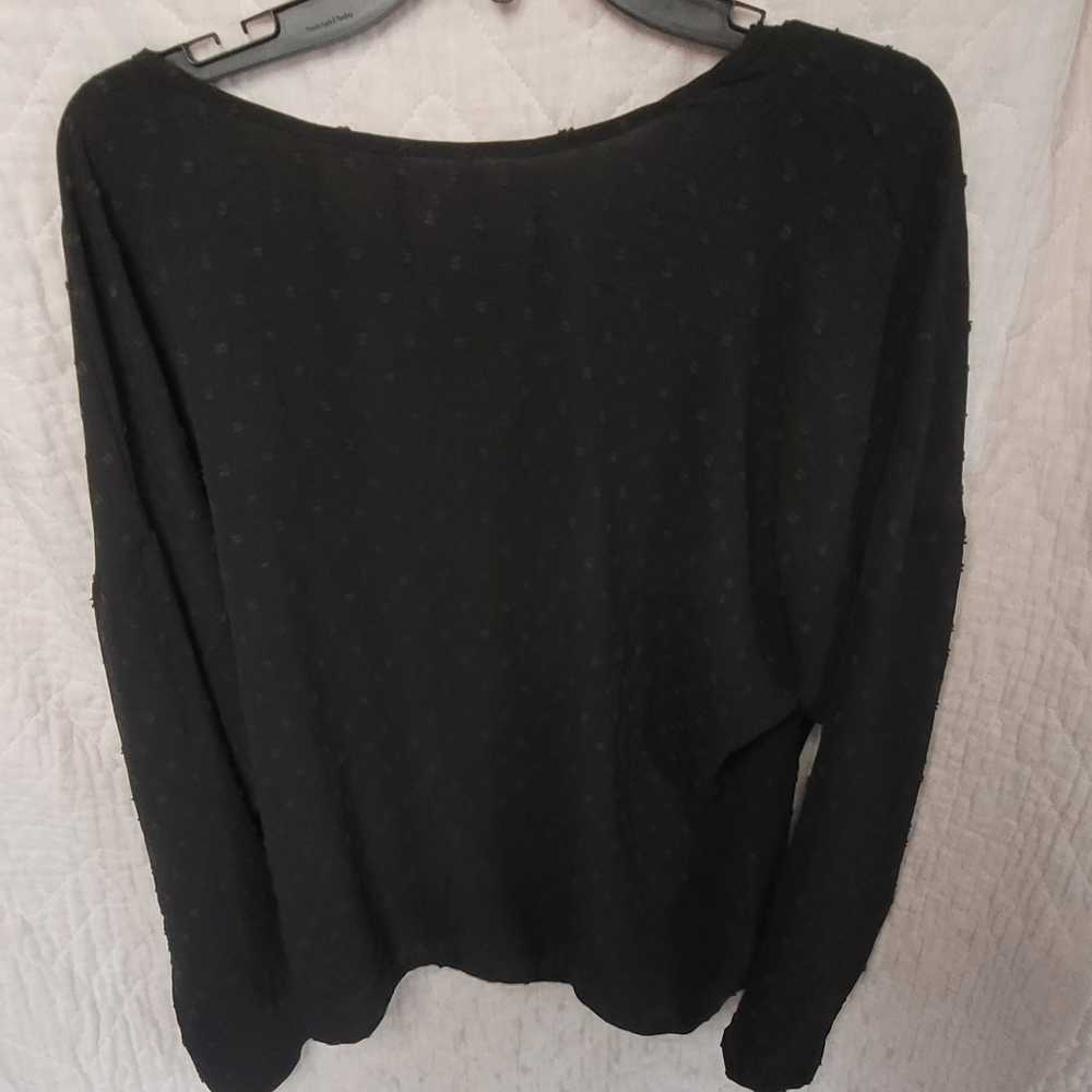 Black long sleeve shirt with fake pearls on the back